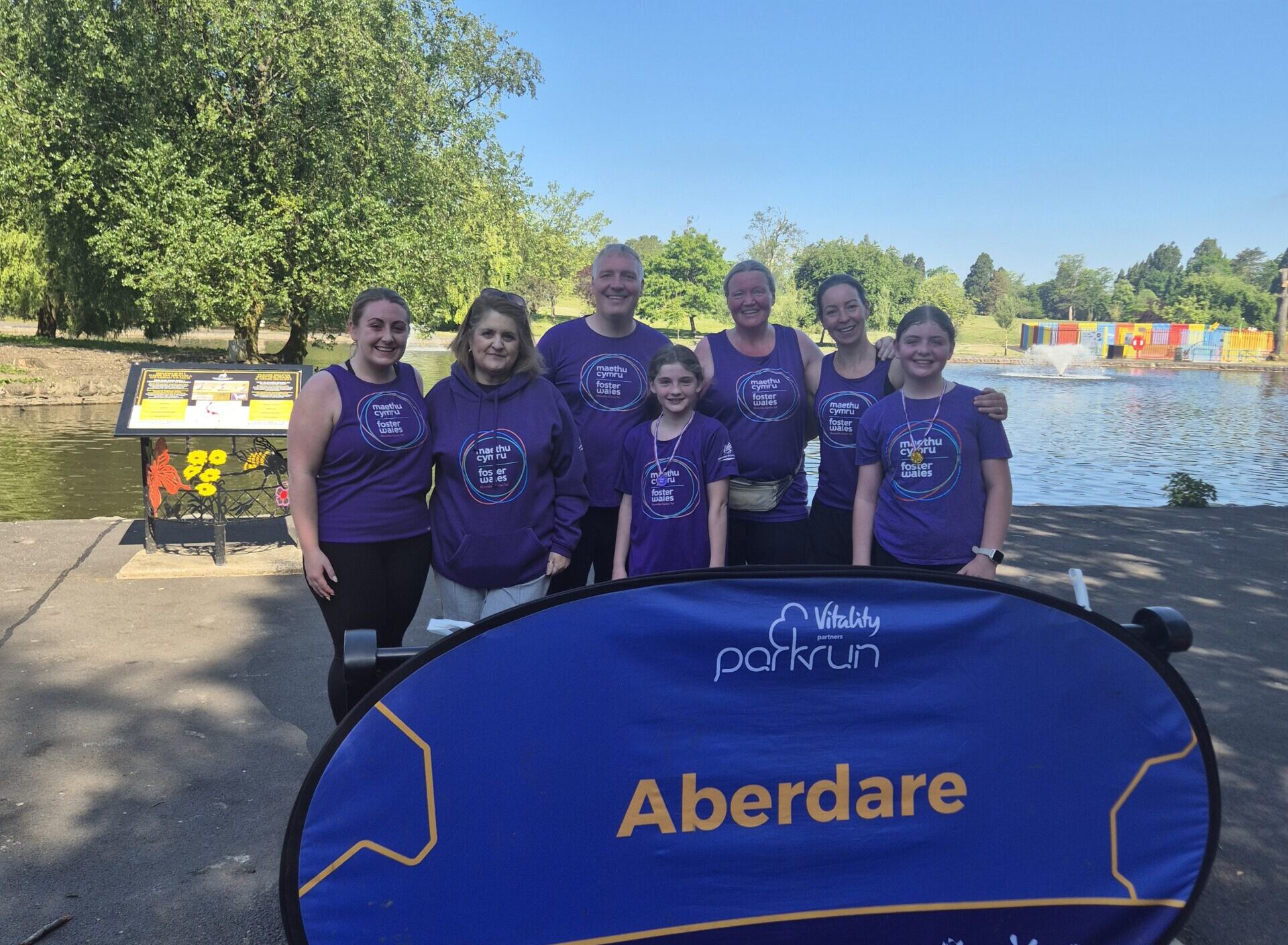 Group of people in Foster Wales tops at parkrun